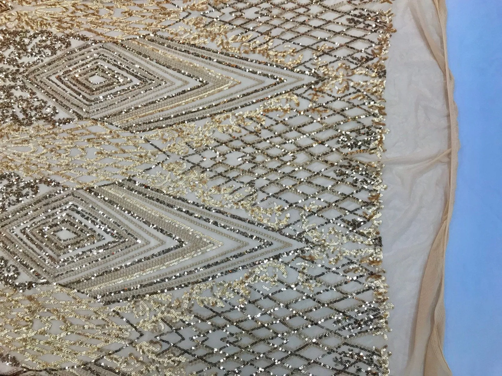 Gold sequin diamond design embroidery on a 4 way stretch mesh-sold by the yard.