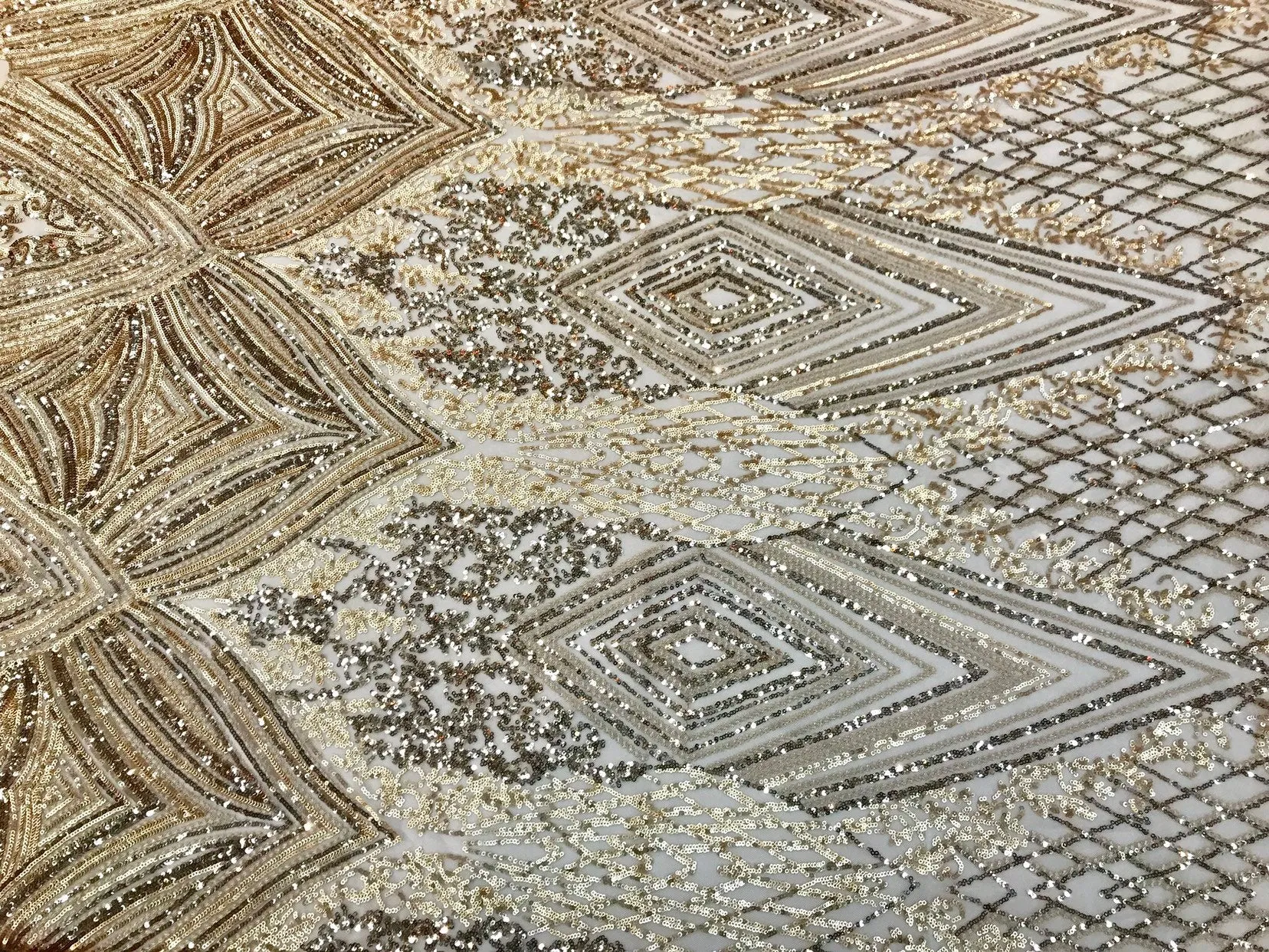 Gold sequin diamond design embroidery on a 4 way stretch mesh-sold by the yard.